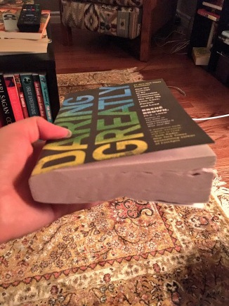 A book with half of the pages warped from water damage
